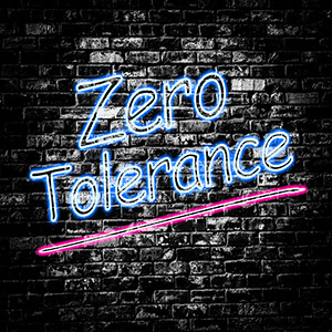 Neon sign saying Zero Tolerance on a brick wall for Florida underage driving law article.