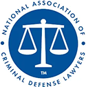 National Association of Criminal Defense Lawyers official logo with scales of justice.